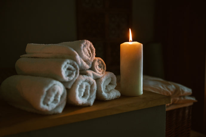 beeswax candle lit at spa