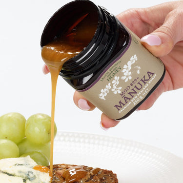 Pouring Mason Brothers Manuka Honey MGO 829+ over food